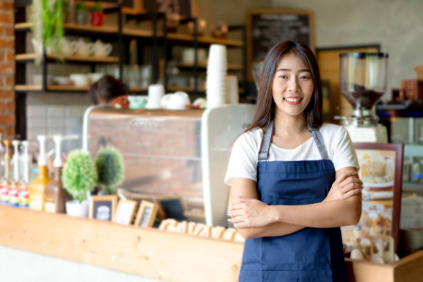 Asian migrant business owners and staff at a café in Hawke's Bay, representing the diverse migrant communities Eastern Bridge engaged during the Statistics New Zealand census programme
