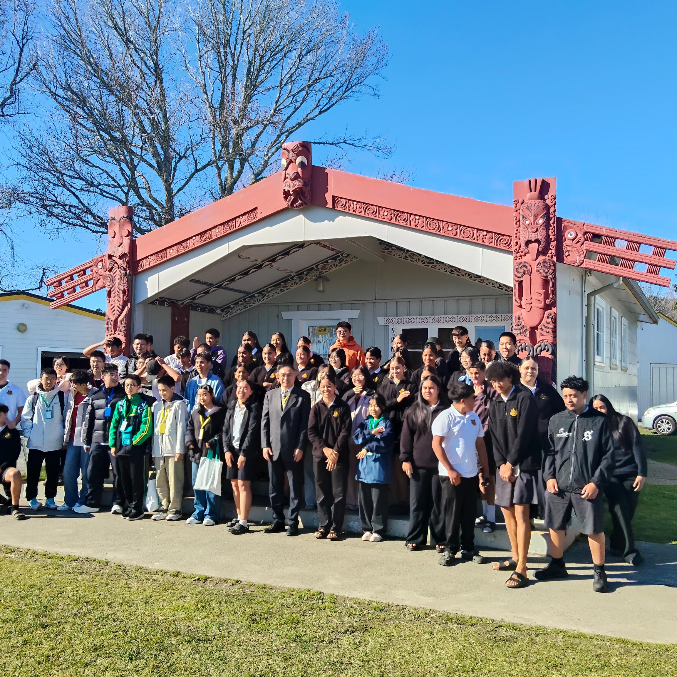 Chinese and Māori people together at a marae