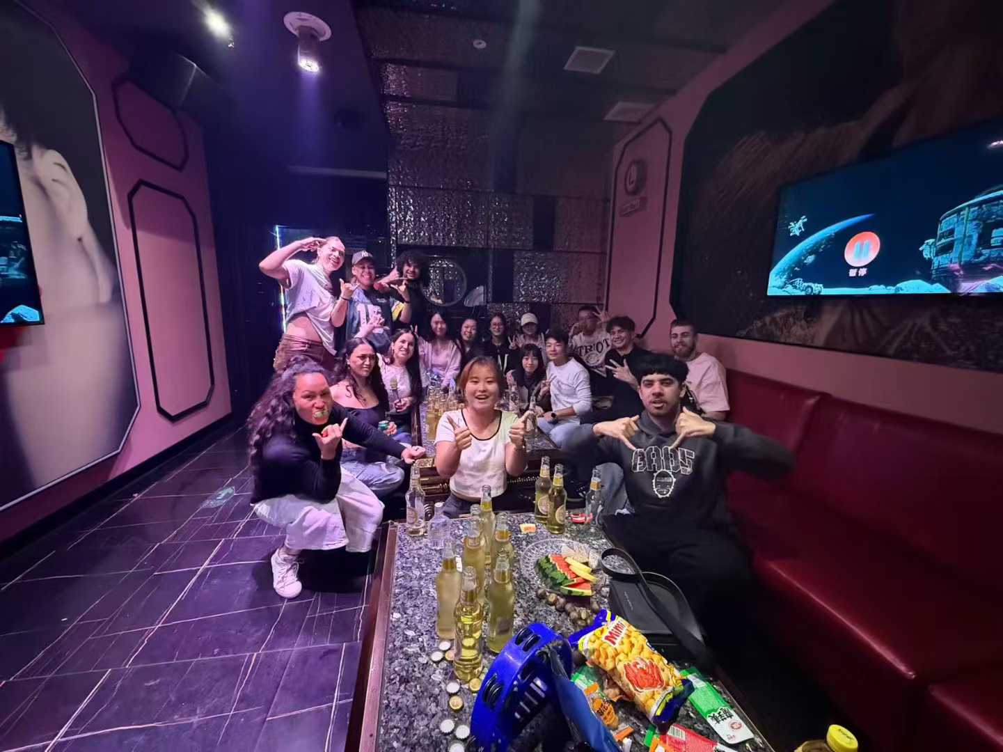 A group of Eastern Bridge volunteers enjoying a night of karaoke (KTV) in China, showcasing the cultural immersion and social aspects of the programme.