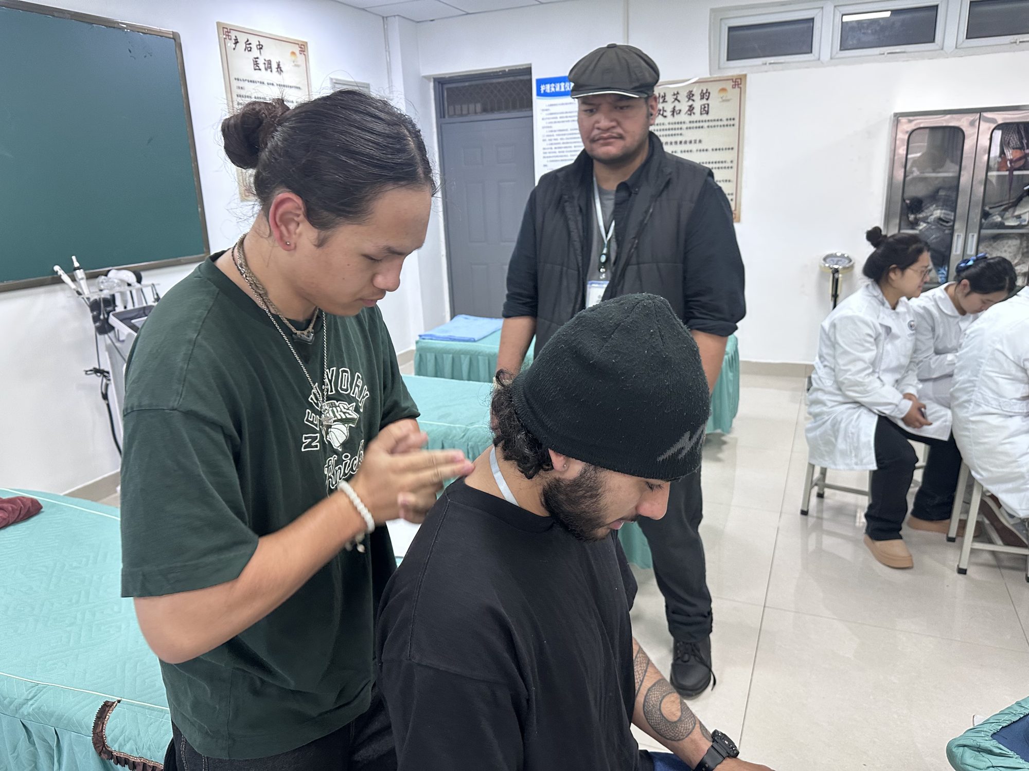 Volunteers learning about traditional Chinese medicine at a clinic