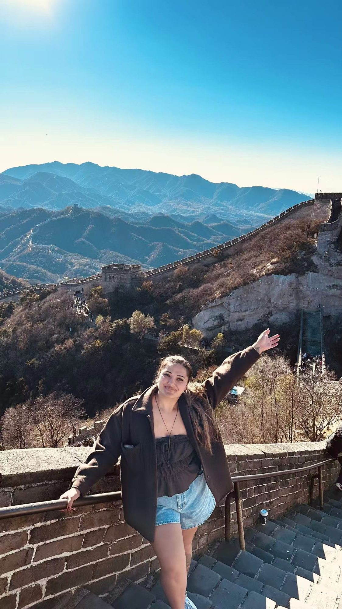 A volunteer on the Great Wall of China on a clear day
