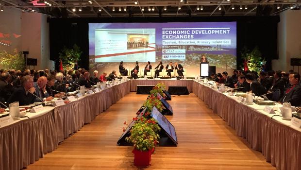 Delegates seated at long conference tables during a mayoral forum in Wellington