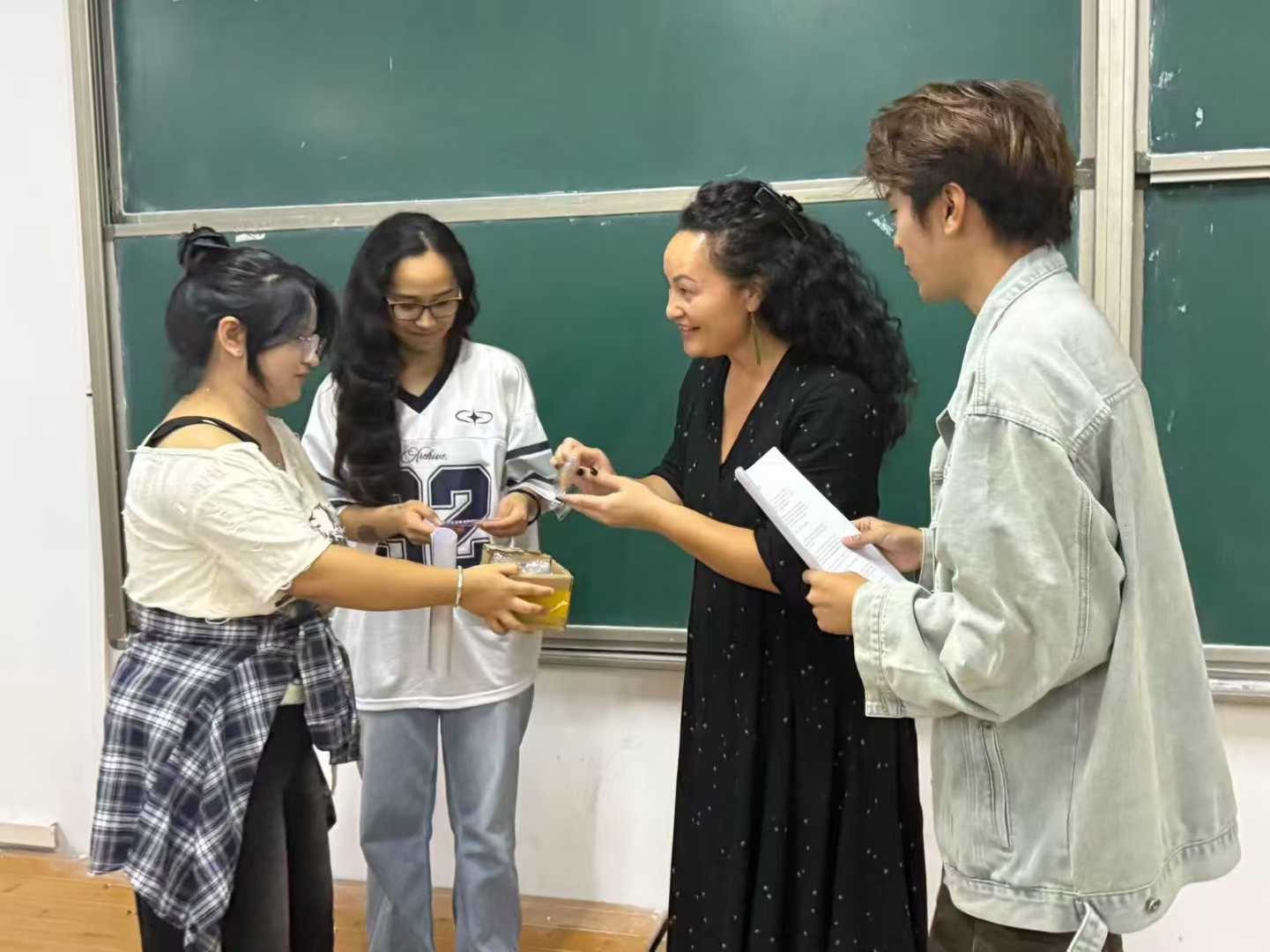 A New Zealand teacher with university students in a classroom in Jiangxi